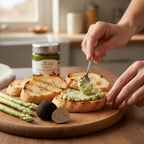 Bruschette di pane artigianale abbrustolito con crema di asparagi e tartufo nero estivo